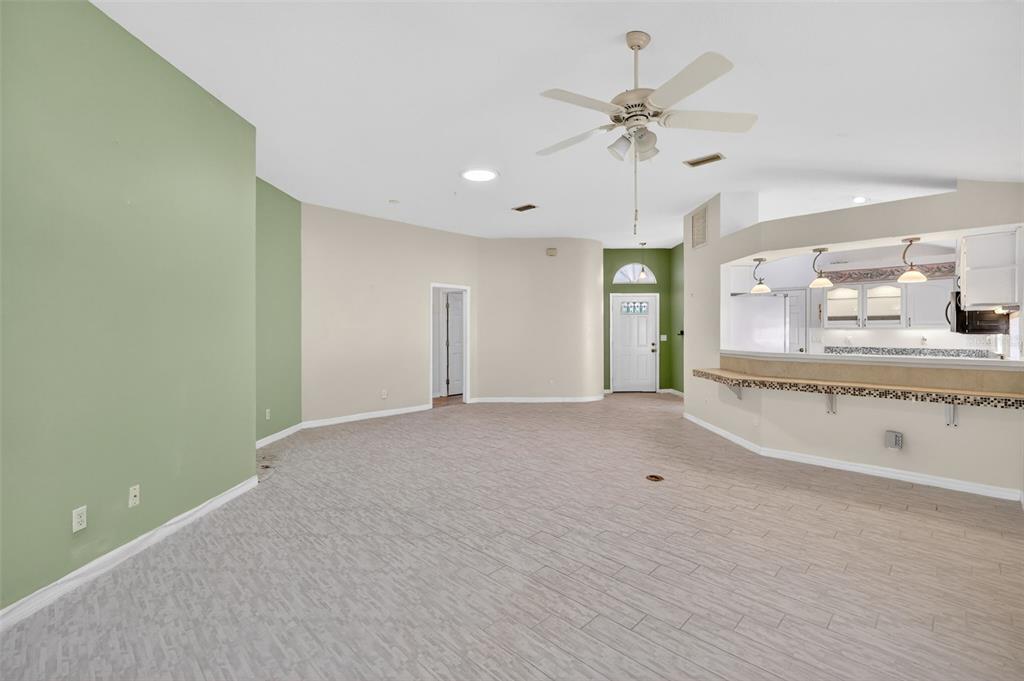 5500 Laver Street Leesburg, FL 34748 - Photo 7 of 35 a view of an empty room with a kitchen