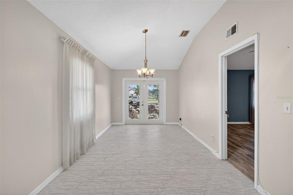 5500 Laver Street Leesburg, FL 34748 - Photo 9 of 35 a view of a hallway with windows