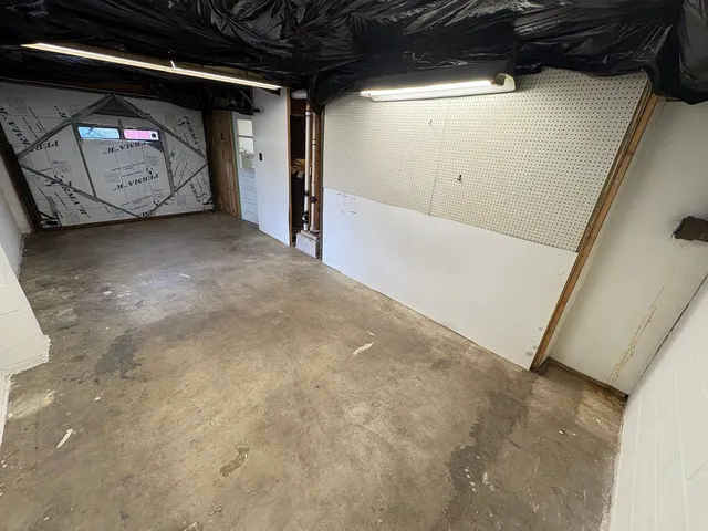 a view of a patio with table and chairs with wooden floor and fence
