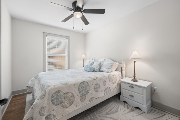 611 South Walnut Street Seneca, SC 29678 - Photo 18 of 31 This light-filled bedroom offers comfortable living with warm flooring and a cooling ceiling fan.