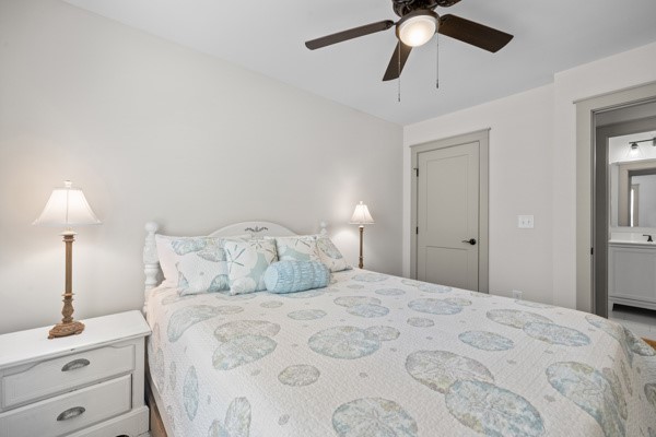 611 South Walnut Street Seneca, SC 29678 - Photo 19 of 31 This inviting bedroom features a cozy bed and convenient access to an adjacent bathroom.