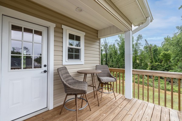 611 South Walnut Street Seneca, SC 29678 - Photo 20 of 31 This inviting porch offers tranquil views, perfect for enjoying peaceful mornings or relaxed evenings outdoors.