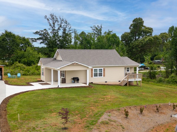 611 South Walnut Street Seneca, SC 29678 - Photo 27 of 31 This charming residence is nestled among verdant trees and boasts a welcoming covered patio.