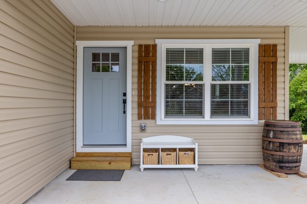 611 South Walnut Street Seneca, SC 29678 - Photo 3 of 31 This inviting entrance features a warm welcome with rustic charm and practical outdoor storage.