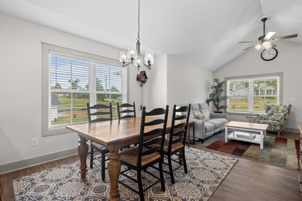 611 South Walnut Street Seneca, SC 29678 - Photo 7 of 31 An inviting open-concept space features a dining area seamlessly connected to a comfortable living room.