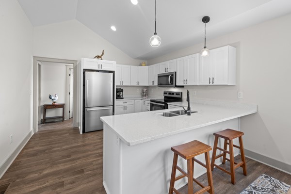 611 South Walnut Street Seneca, SC 29678 - Photo 8 of 31 This bright kitchen features vaulted ceilings and modern appliances, perfect for everyday living.