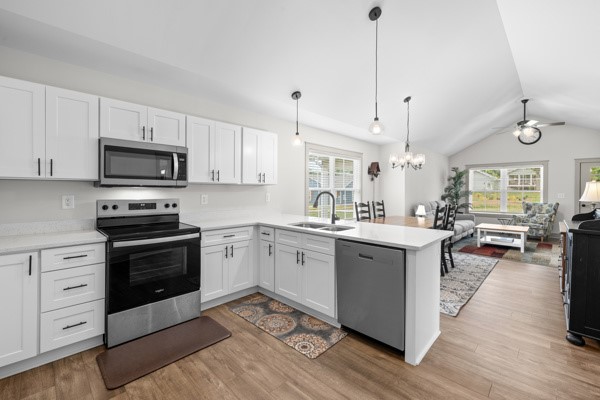 611 South Walnut Street Seneca, SC 29678 - Photo 10 of 31 This bright kitchen with ample cabinetry connects seamlessly to an inviting living area, perfect for daily living.