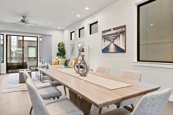 a view of a livingroom with furniture and large windows