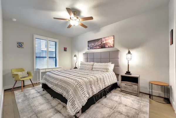 a bedroom with a bed and furniture