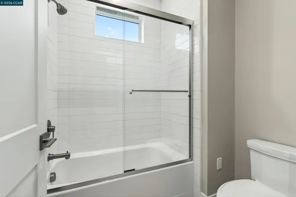 a bathroom with a bathtub and a toilet