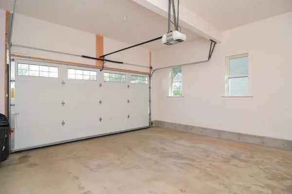 a view of a room with window and ceiling fan