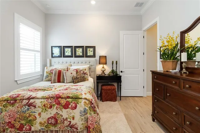 a view of a dining room with furniture wooden floor and a potted plant