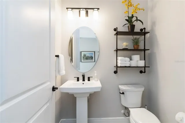 an aerial view of a house with a swimming pool outdoor seating and yard