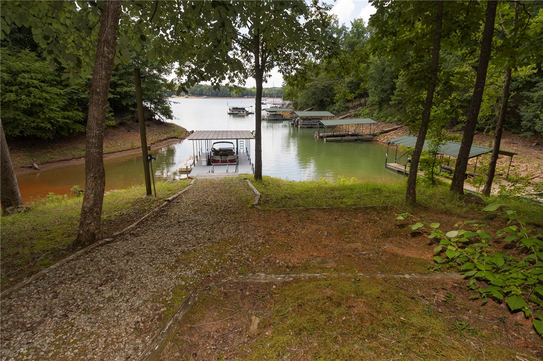 125 Inlet Pointe Drive Anderson, SC 29625 - Photo 5 of 39 Boasting multiple boat slips, this waterfront property offers direct access to a serene lake.