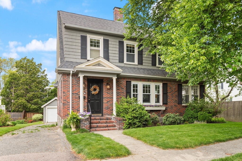 61 Howitt Road Boston, MA 02132 - Photo 1 of 42 a front view of a house with garden