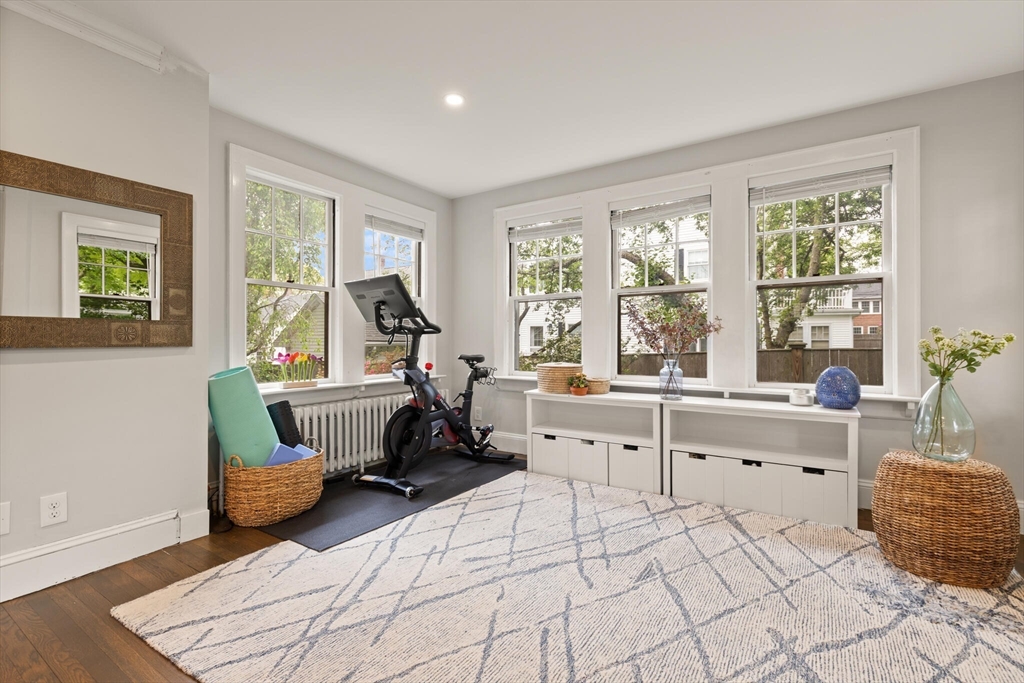 61 Howitt Road Boston, MA 02132 - Photo 12 of 42 a room with furniture and a large window