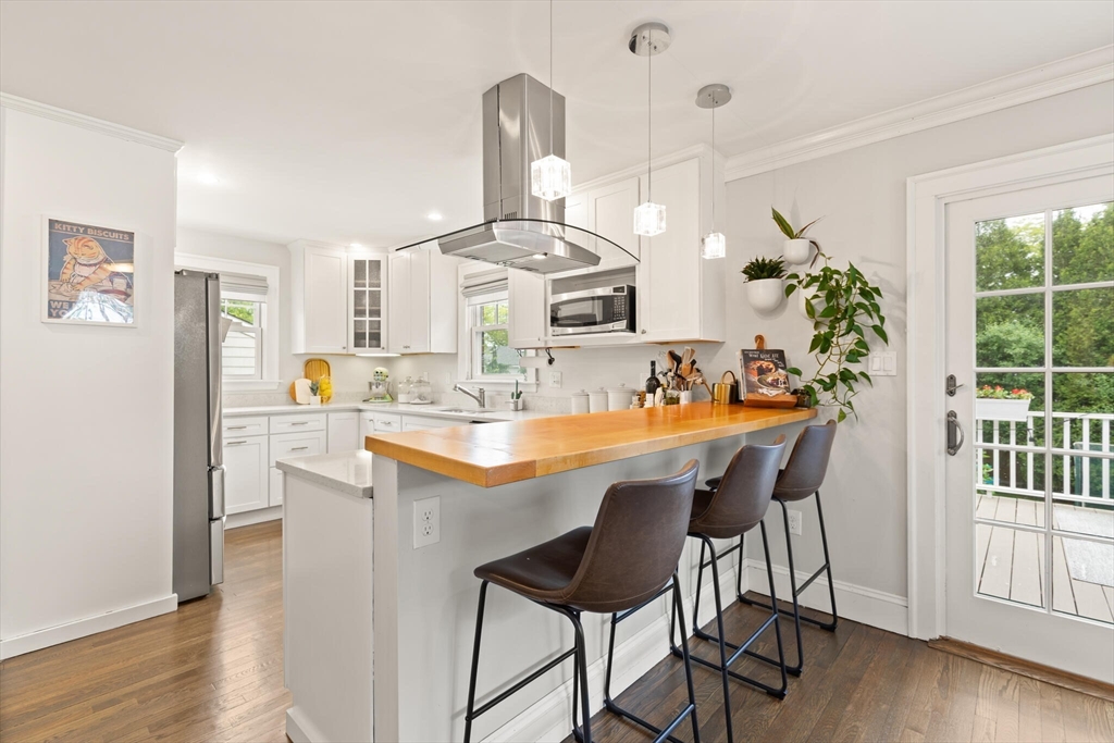 61 Howitt Road Boston, MA 02132 - Photo 13 of 42 a dining room with furniture and wooden floor