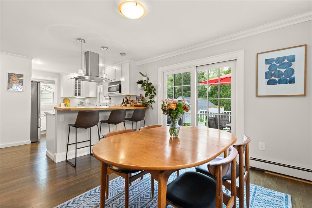 61 Howitt Road Boston, MA 02132 - Photo 15 of 42 a view of a dining room with furniture and wooden floor