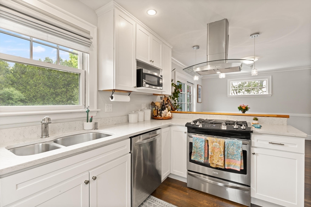 61 Howitt Road Boston, MA 02132 - Photo 17 of 42 a kitchen with stainless steel appliances white cabinets and a sink