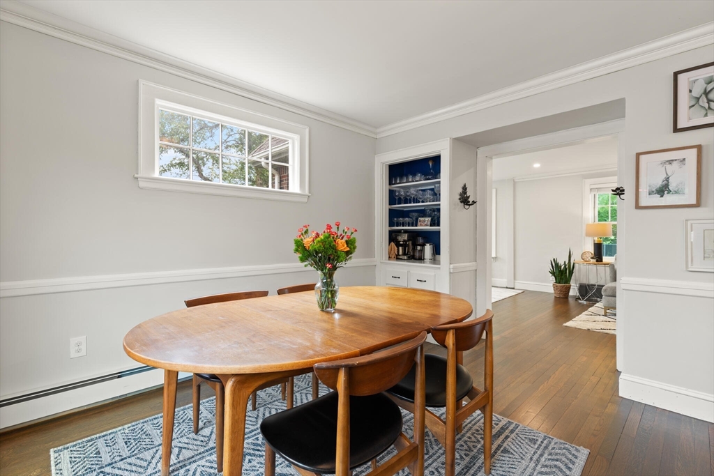 61 Howitt Road Boston, MA 02132 - Photo 21 of 42 a view of a dining room with furniture and wooden floor