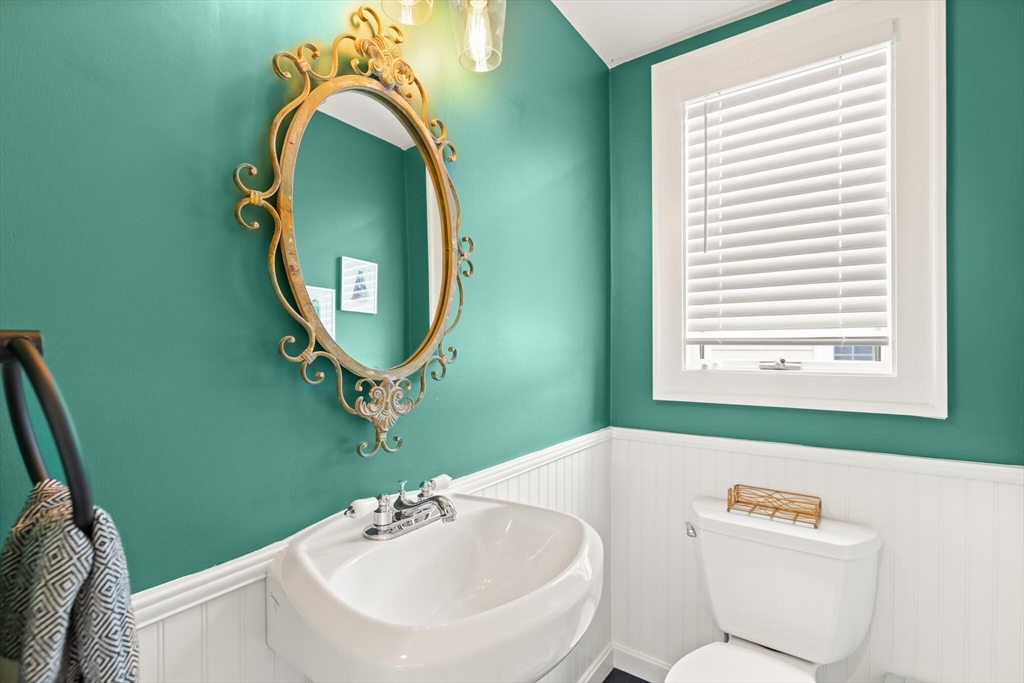 61 Howitt Road Boston, MA 02132 - Photo 23 of 42 a bathroom with a sink mirror and toilet