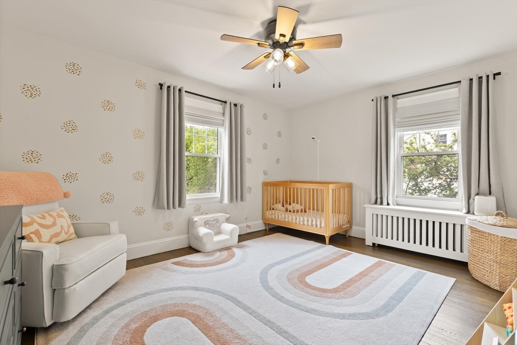 61 Howitt Road Boston, MA 02132 - Photo 28 of 42 a bedroom with furniture and a window