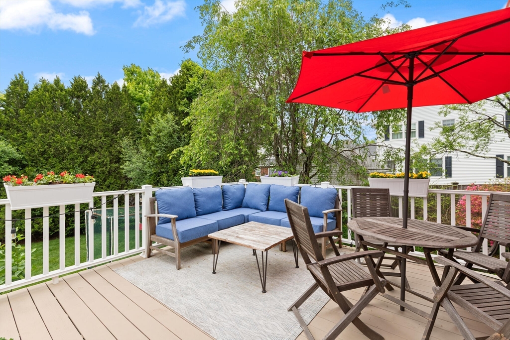 61 Howitt Road Boston, MA 02132 - Photo 30 of 42 a view of a chair and table on the deck