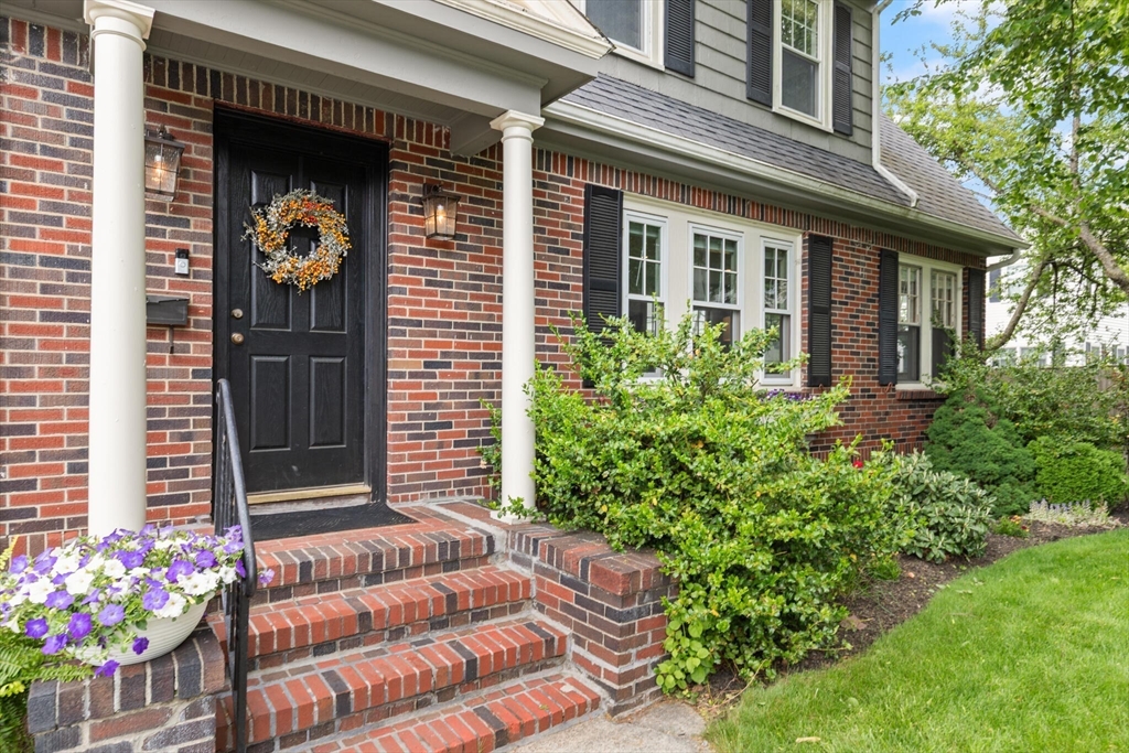 61 Howitt Road Boston, MA 02132 - Photo 3 of 42 a front view of a house with outdoor seating