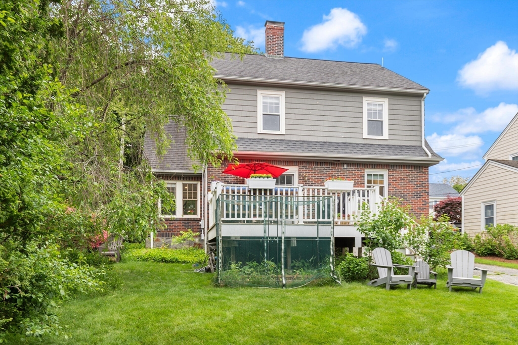 61 Howitt Road Boston, MA 02132 - Photo 33 of 42 a front view of a house with a garden