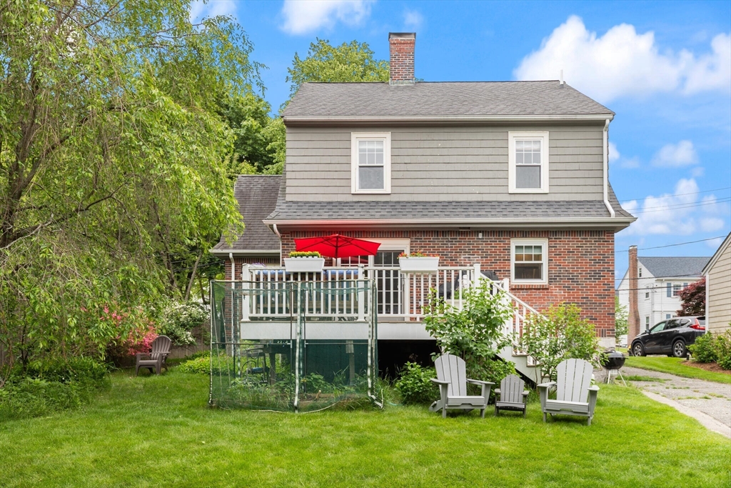 61 Howitt Road Boston, MA 02132 - Photo 34 of 42 a front view of a house with a garden