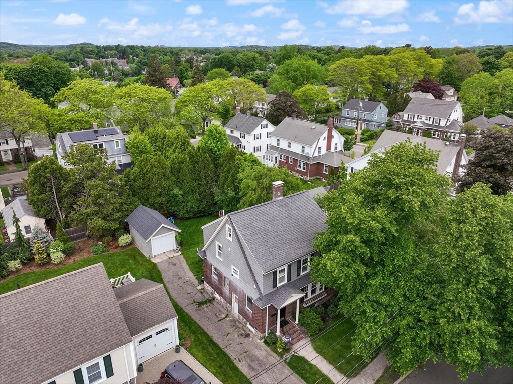 61 Howitt Road Boston, MA 02132 - Photo 39 of 42 an aerial view of a house with garden space and street view