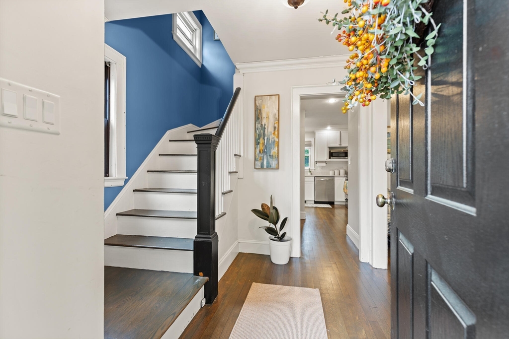 61 Howitt Road Boston, MA 02132 - Photo 4 of 42 a view of entryway and hall with wooden floor