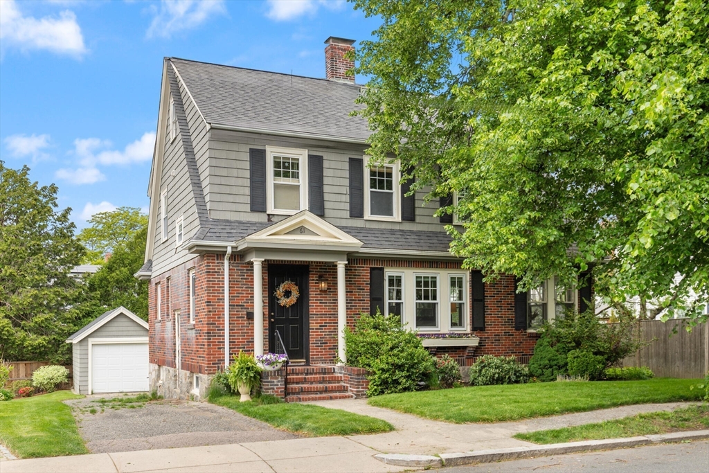 61 Howitt Road Boston, MA 02132 - Photo 42 of 42 a front view of a house with a yard