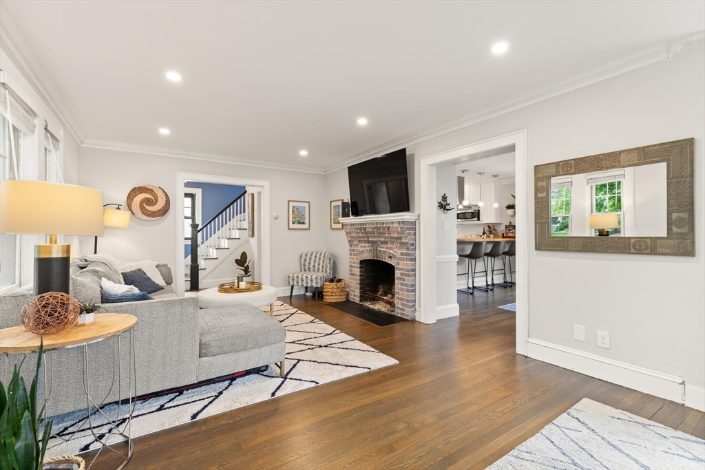 61 Howitt Road Boston, MA 02132 - Photo 6 of 42 a living room with furniture and a fireplace