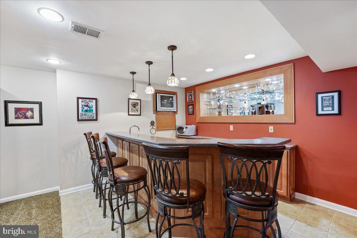 2228 Locust Drive Lansdale, PA 19446 - Photo 40 of 57 Finished basement with wet bar & wine refrigerator