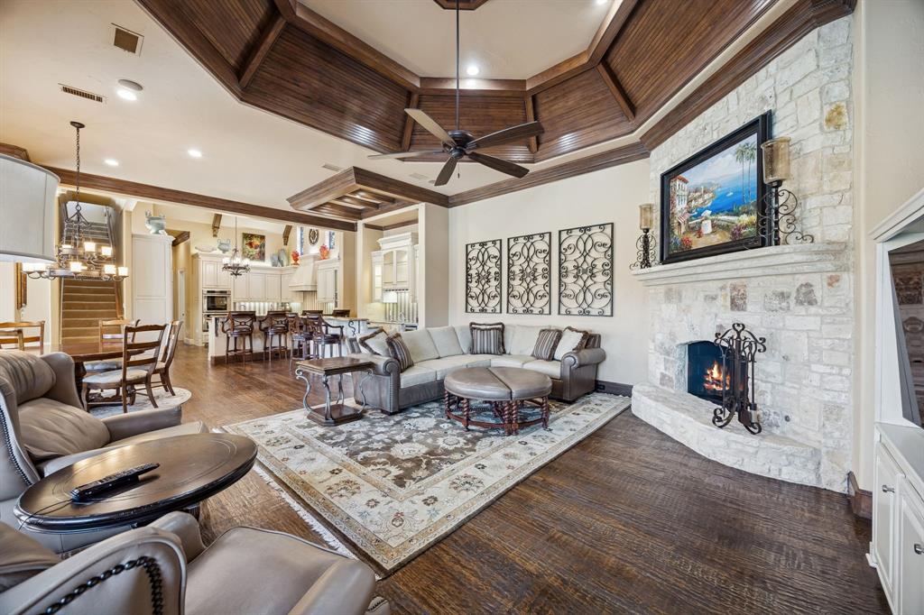 6640 Briar Ridge Lane Plano, TX 75024 - Photo 18 of 40 Coffered ceiling, stone fireplace, hand scraped hardwoods, built-in cabinetry