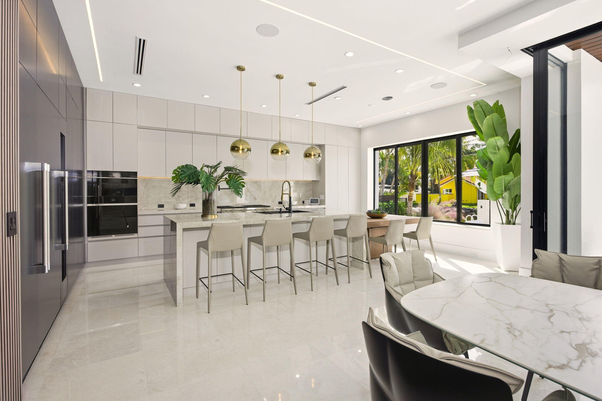 798 Havana Drive Boca Raton, FL 33487 - Photo 13 of 76 a dining room with furniture a rug and a large window