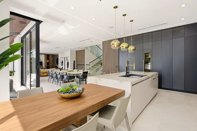 a bathroom with a granite countertop sink vanity mirror and toilet