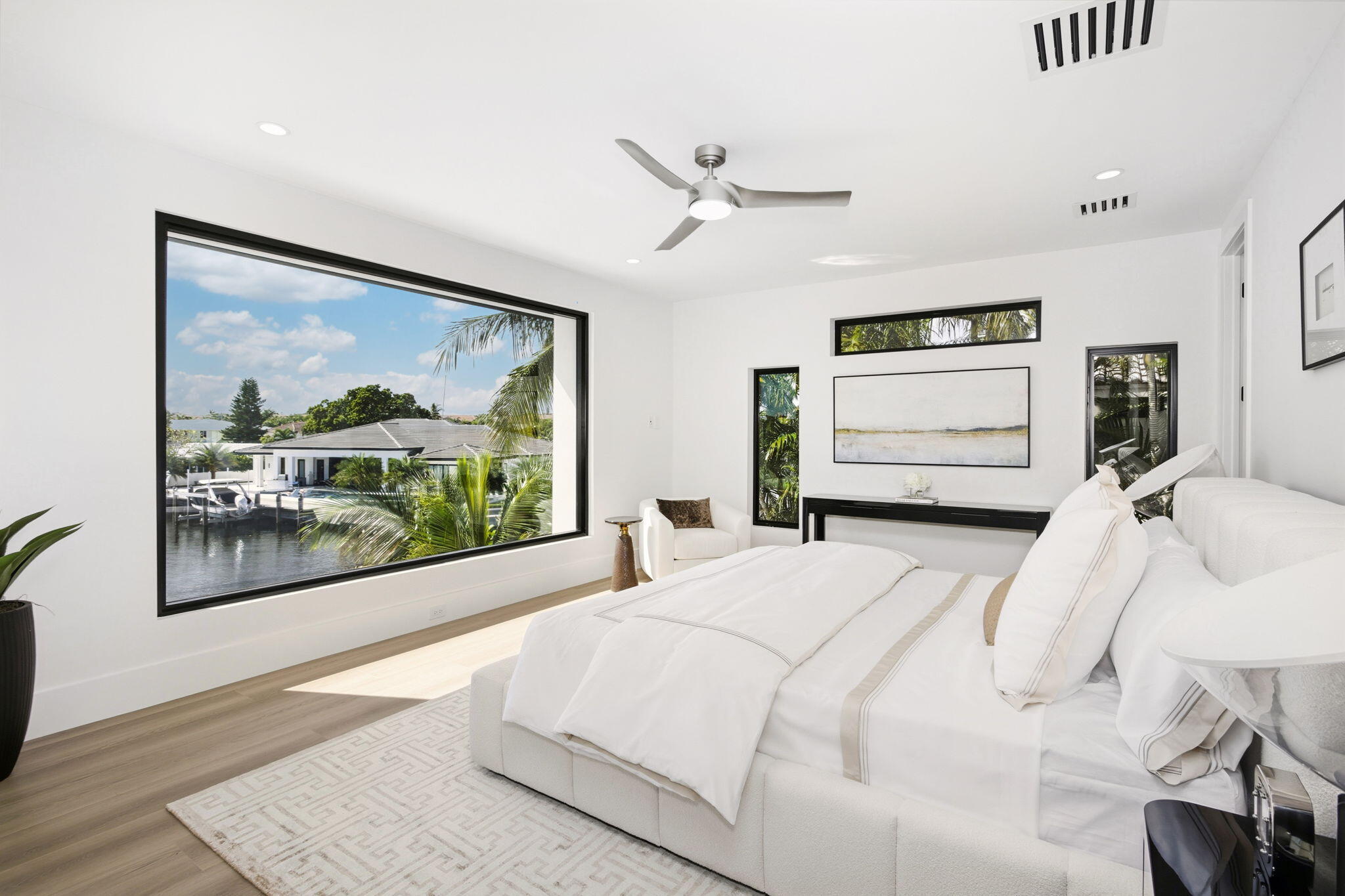 798 Havana Drive Boca Raton, FL 33487 - Photo 42 of 76 a bedroom with a large bed and a painting on the wall