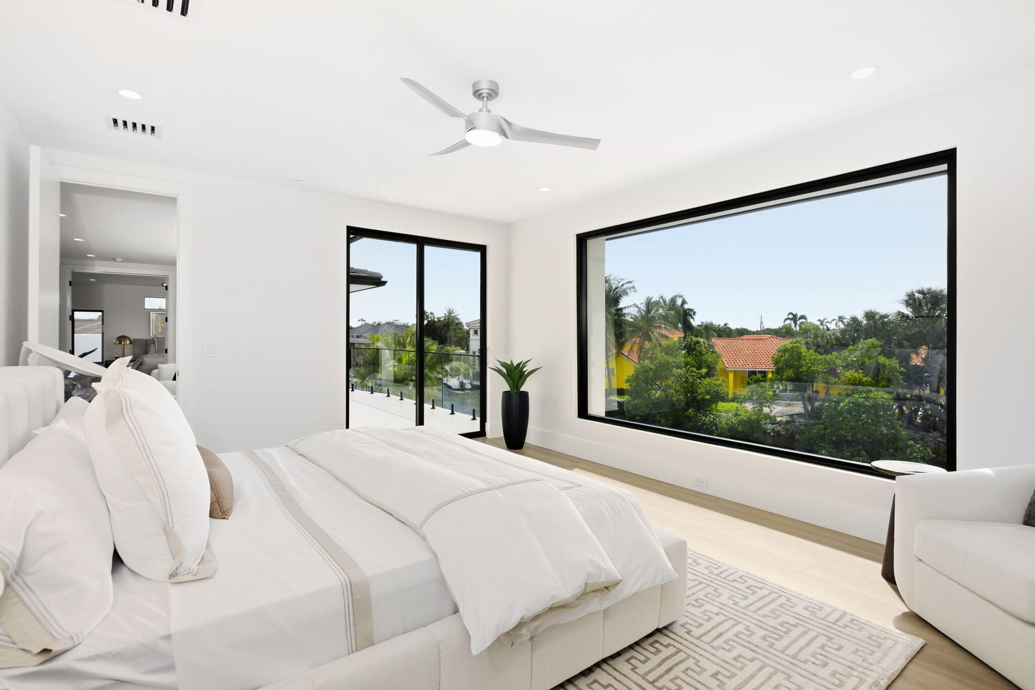 798 Havana Drive Boca Raton, FL 33487 - Photo 43 of 76 a bedroom with a large bed and a large window