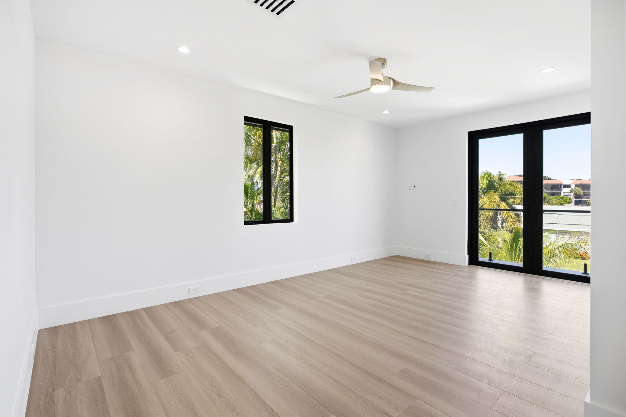 798 Havana Drive Boca Raton, FL 33487 - Photo 48 of 76 wooden floor in an empty room with a window