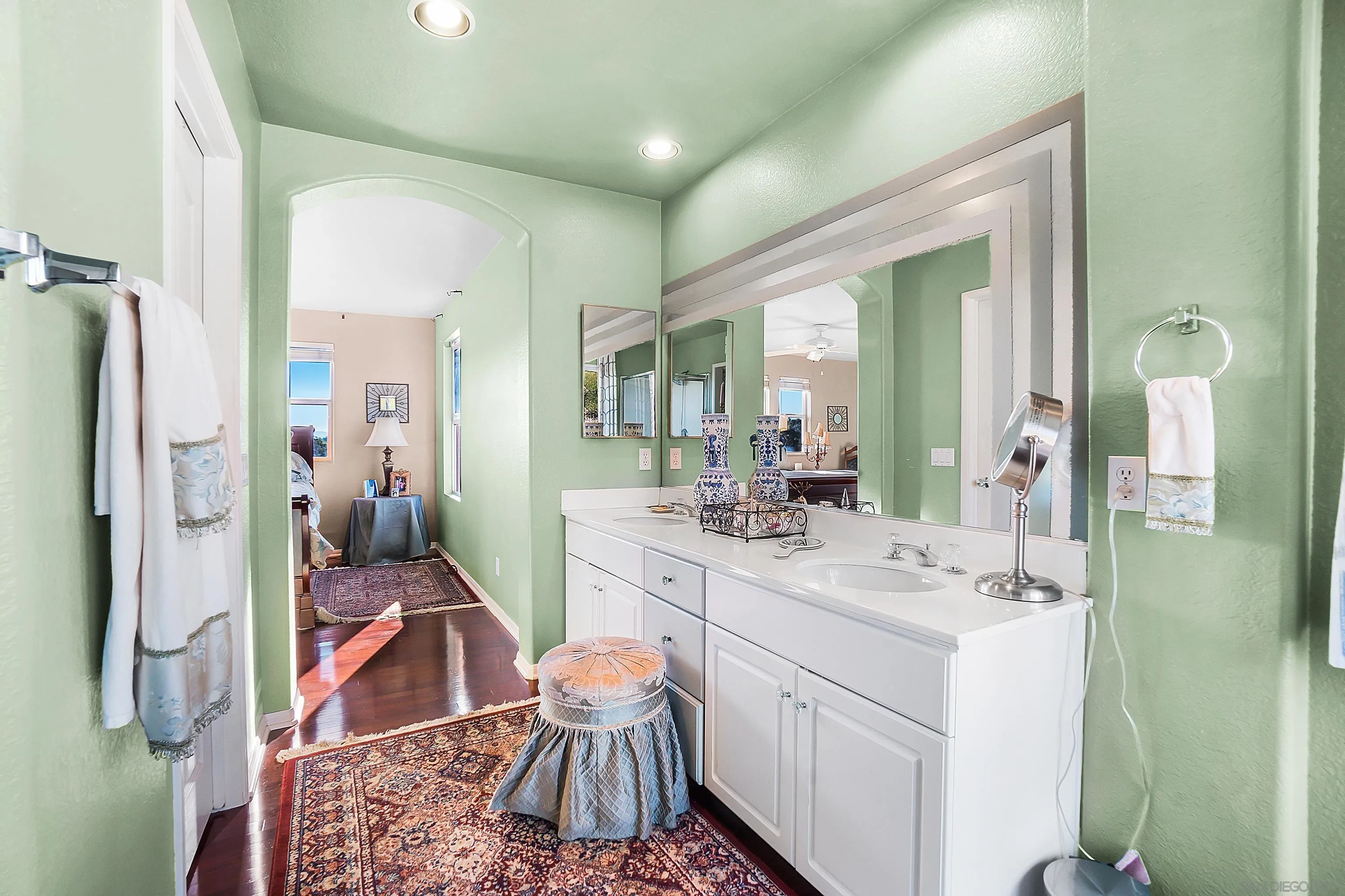2069 Boulders Road Alpine, CA 91901 - Photo 11 of 13 a spacious bathroom with a sink vanity granite and a mirror