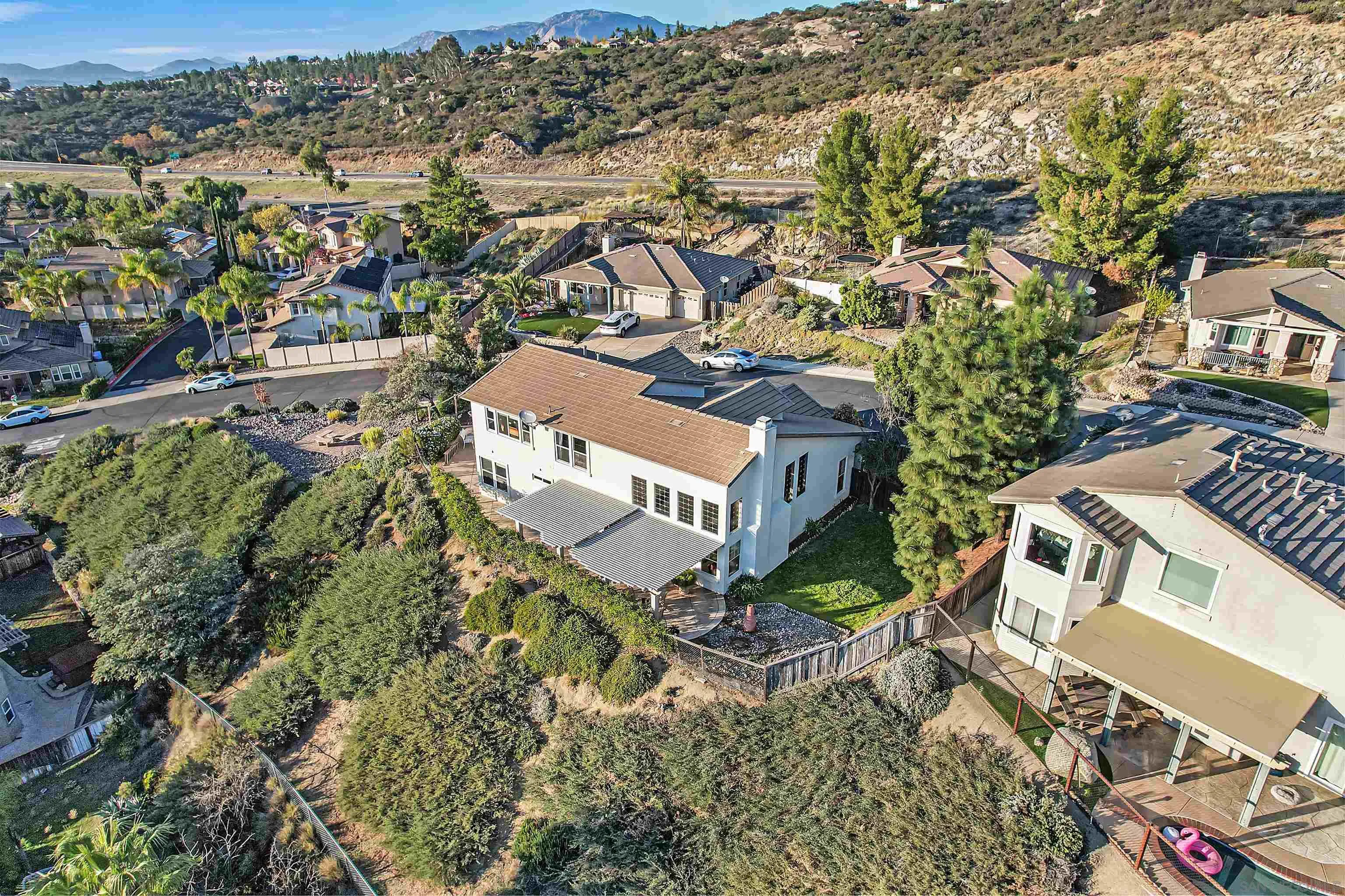 2069 Boulders Road Alpine, CA 91901 - Photo 13 of 13 an aerial view of a house with a yard and outdoor seating