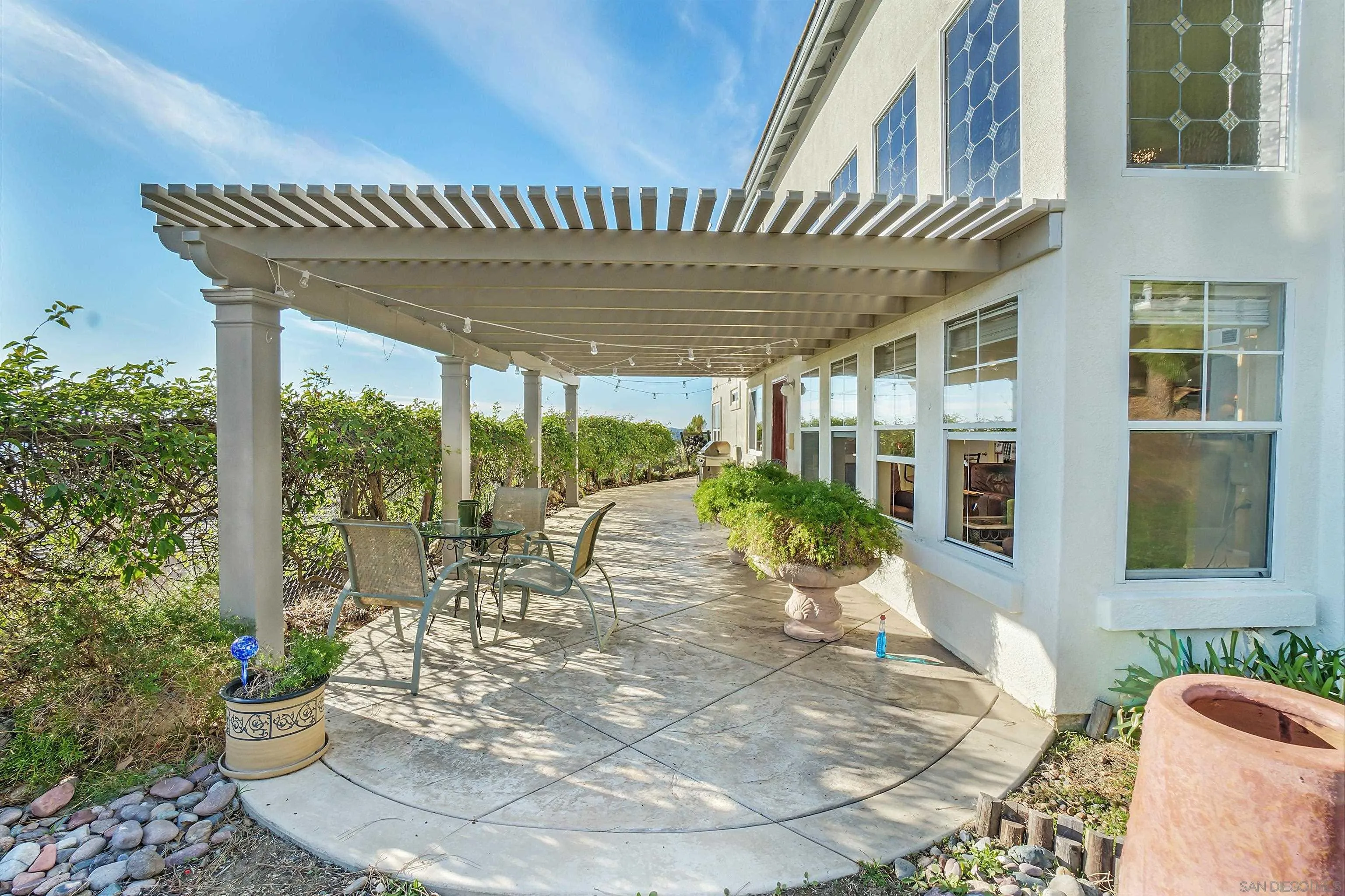 2069 Boulders Road Alpine, CA 91901 - Photo 2 of 13 a view of a chairs and table in patio