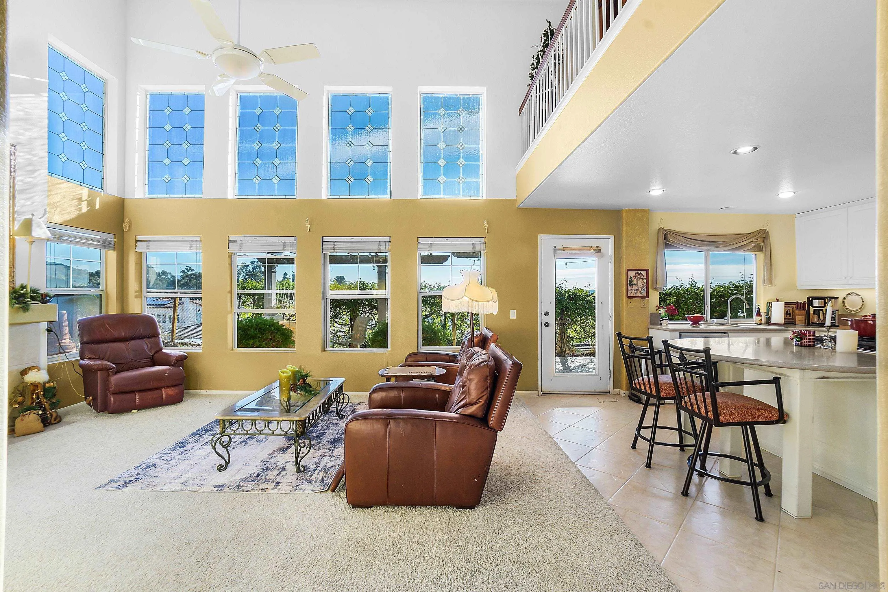 2069 Boulders Road Alpine, CA 91901 - Photo 6 of 13 a living room with furniture and large windows