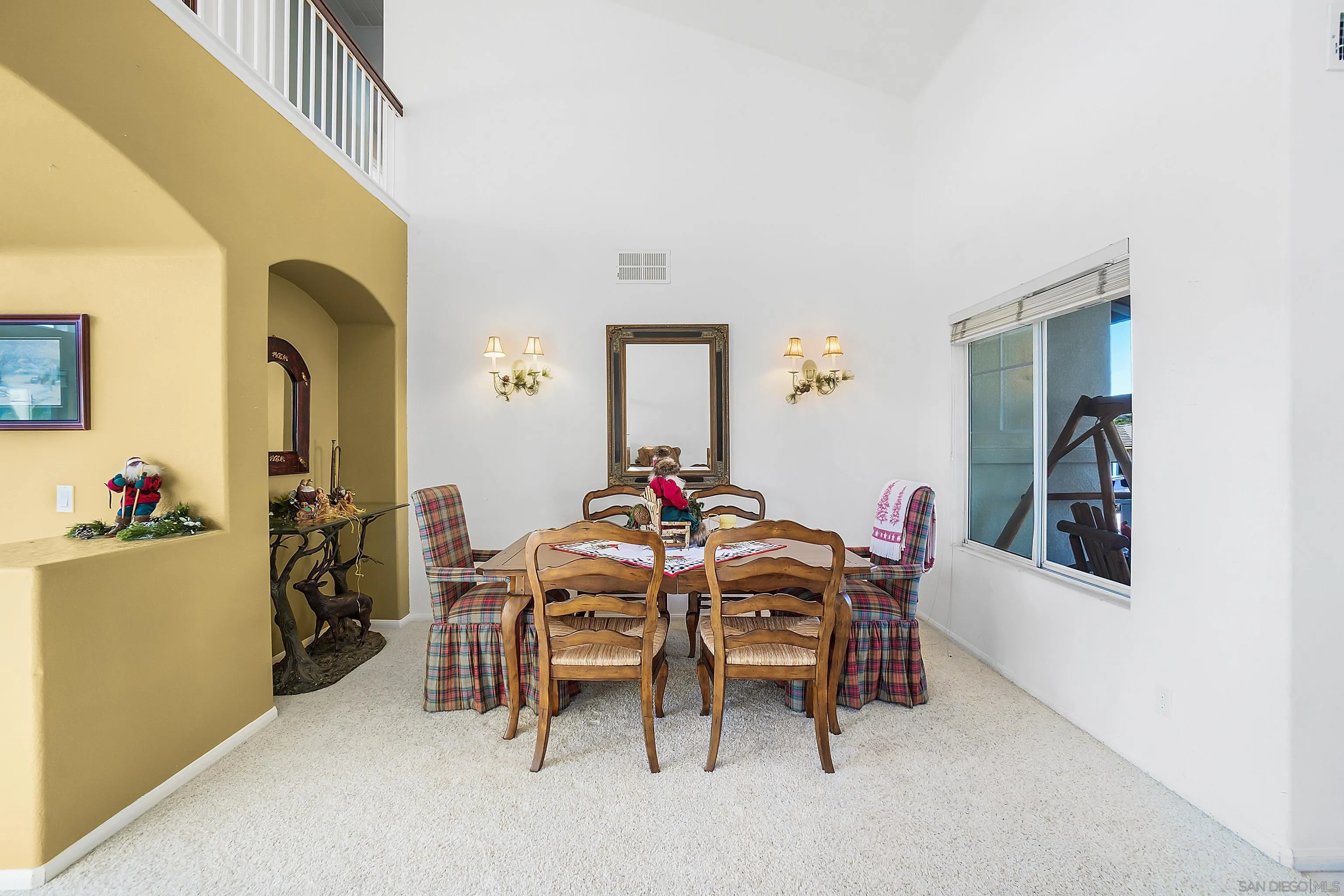 2069 Boulders Road Alpine, CA 91901 - Photo 7 of 13 a view of a dining room with furniture and a chandelier