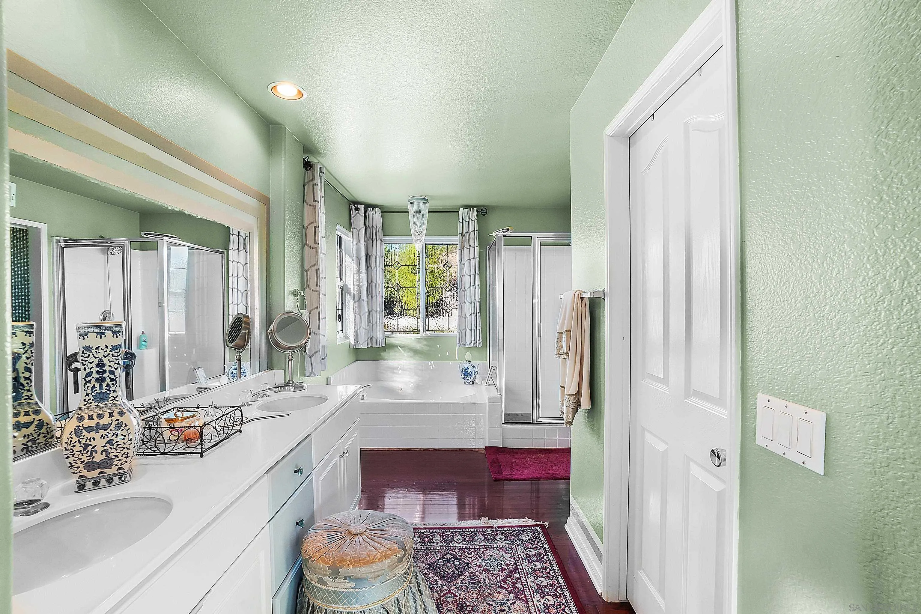 2069 Boulders Road Alpine, CA 91901 - Photo 10 of 13 a bathroom with a double vanity sink mirror and shower
