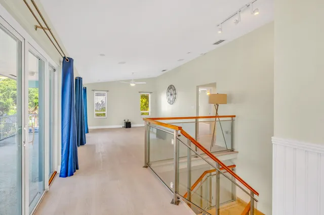 a view of a hallway with staircase