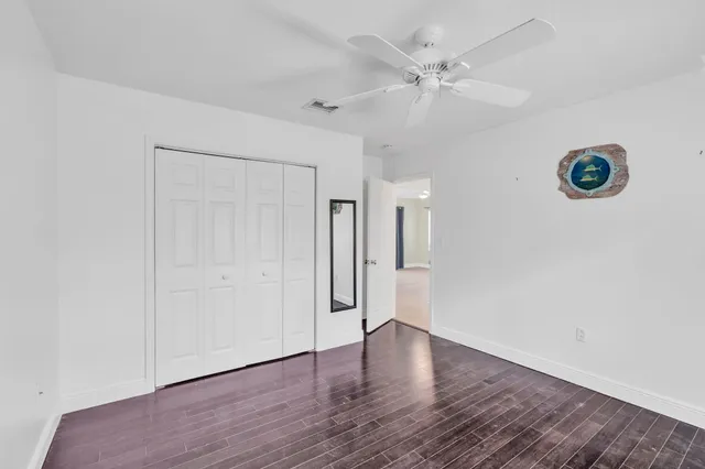 a view of an empty room with a fan