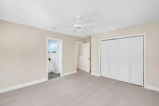 an empty room with closet area